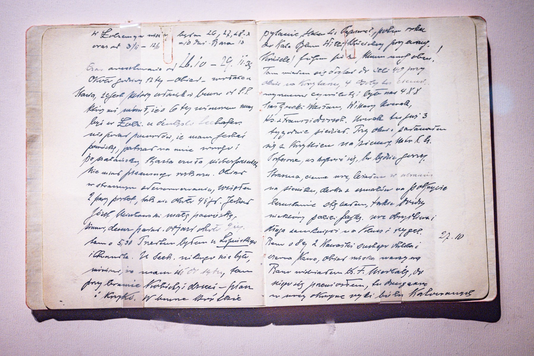 An open notebook with handwritten text on pages