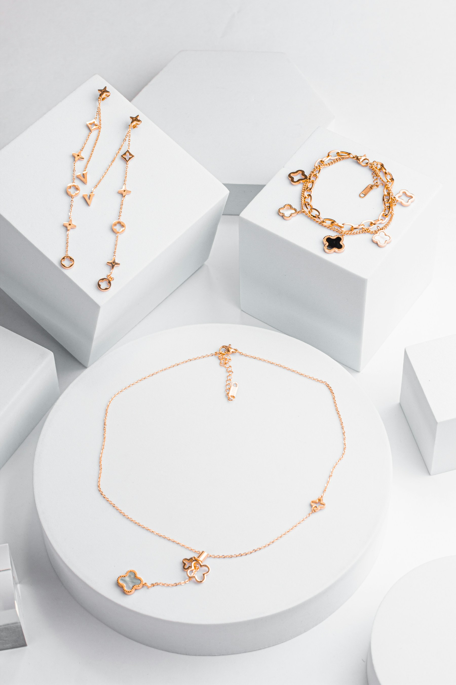A collection of jewelry on a white surface