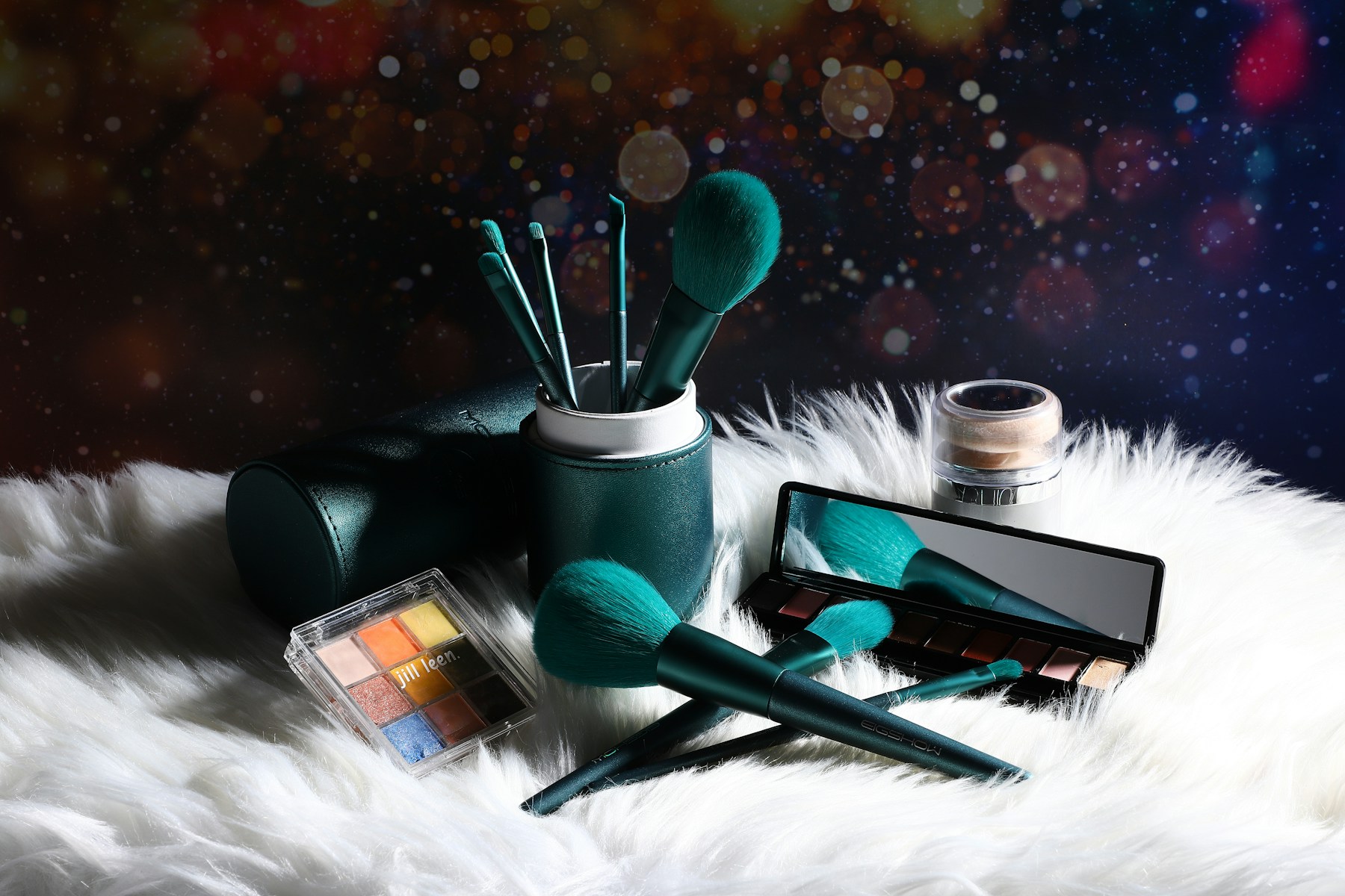 a collection of makeup brushes and other items